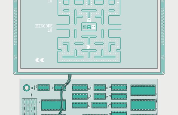 a-small-flatscreen-display-a-pac-man-playfield-it-is-connected-via-a-bundle-of-wires-to-a-small-circuit-board-covered-by-dual-i.jpg